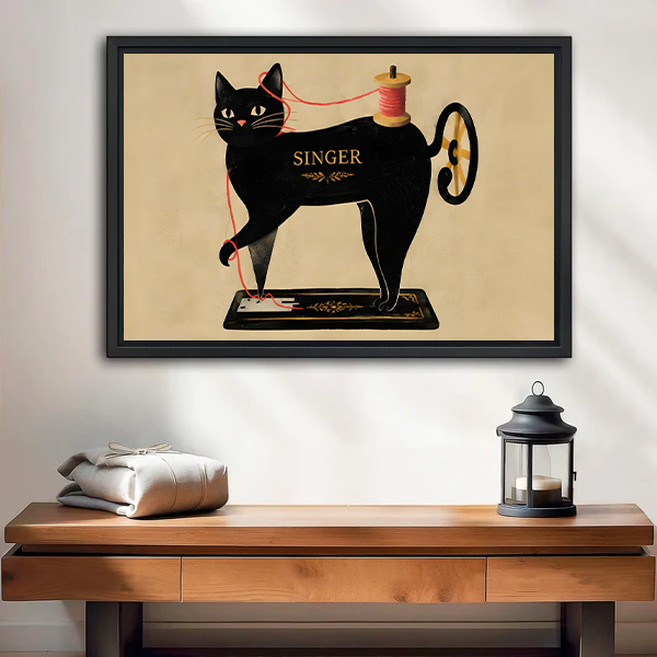 Vintage sewing cat canvas wall art featuring a black cat on a classic Singer sewing machine above a wooden console.