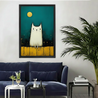 Framed white cat moon canvas wall art displayed above a modern dark blue living room sofa.