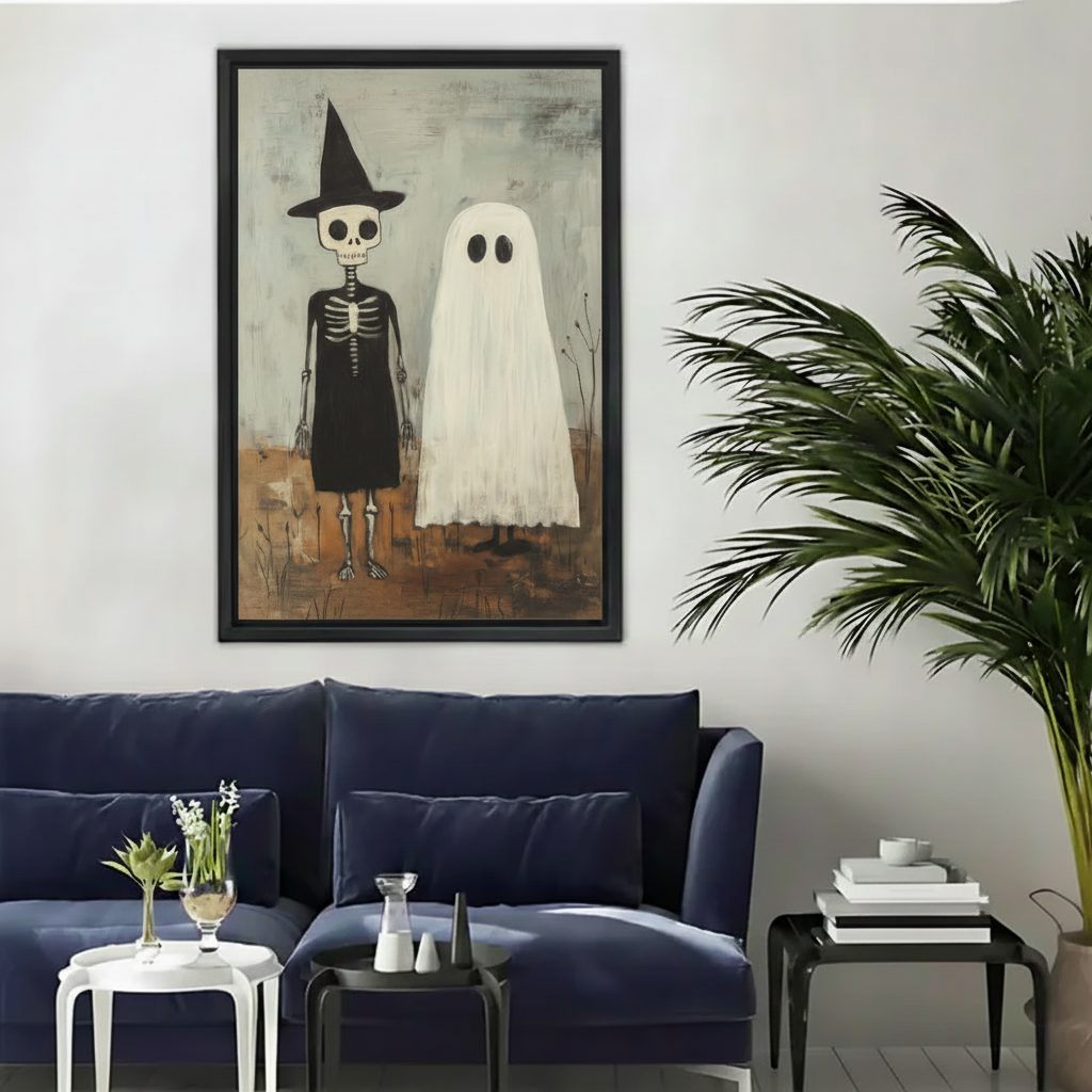  Framed witch and ghost Halloween canvas wall art displayed above a modern dark blue living room sofa.