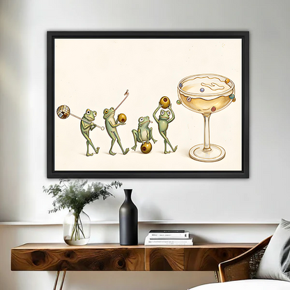 Framed frog cocktail canvas wall art above a wood console, showing green frogs beside an oversized cocktail glass.