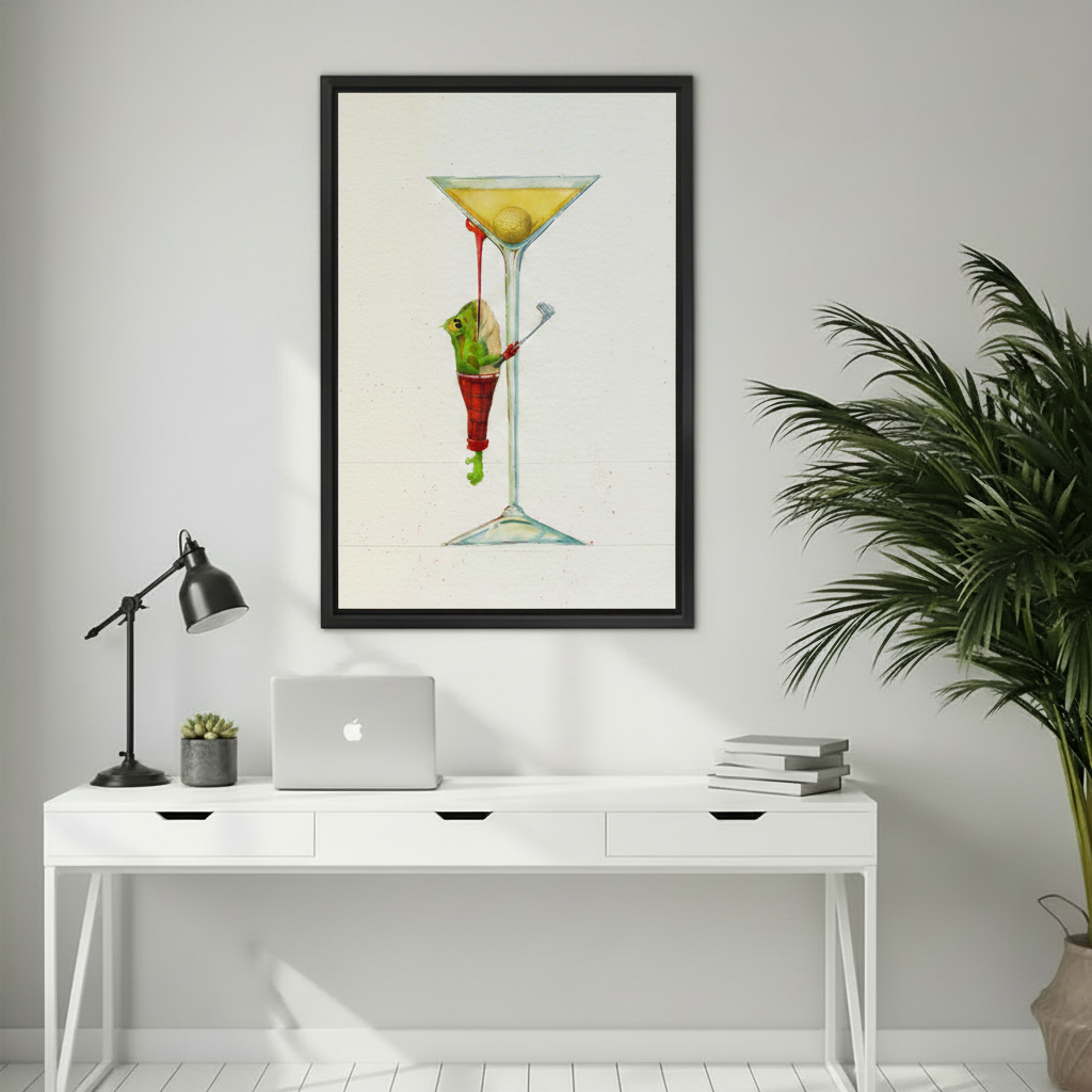 Framed watercolor frog martini wall art print above white home office desk with laptop and lamp