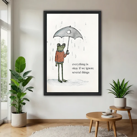  Framed whimsical frog umbrella quote canvas wall art with funny text hanging in a bright living room flanked by two green plants