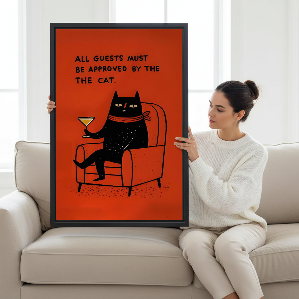 A woman holds funny black cat cocktail canvas wall art with a lounging cat, martini glass, and guest approval message.