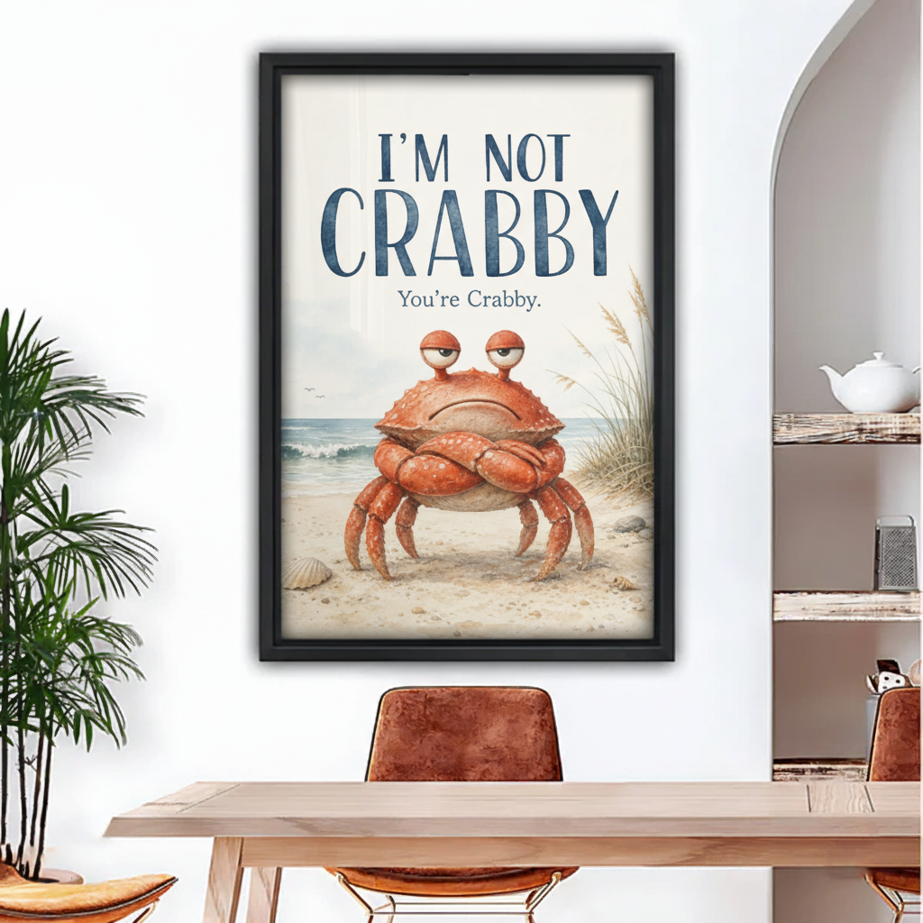 Funny crabby crab canvas wall art in black frame hanging above wooden dining table in bright coastal room