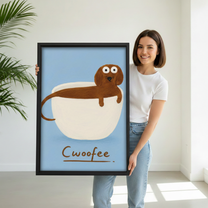 Woman holding large funny Cwoofee dachshund framed canvas wall art showing size reference in bright studio