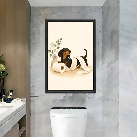 Funny black tan dachshund toilet paper roll eucalyptus vase cream black framed canvas wall art on gray marble tile wall above white toilet beside marble vanity with makeup brushes
