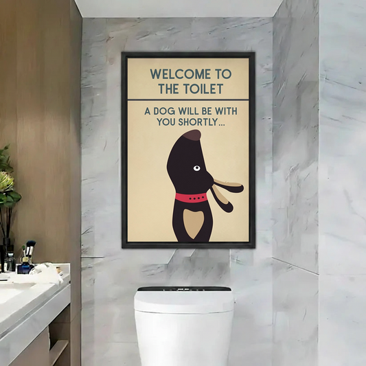 Funny dachshund toilet welcome sign canvas wall art in black floating frame above toilet in marble bathroom