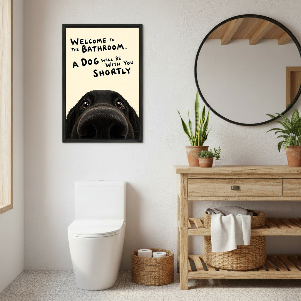 Funny dog bathroom quote welcome black labrador peeking cream black framed canvas wall art beside round black mirror above wood drawer vanity with terracotta snake plant pots