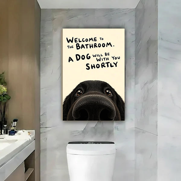 Funny dog bathroom welcome a dog will be with you shortly black labrador gallery wrap canvas wall art on gray marble wall above white toilet beside vanity with green succulent