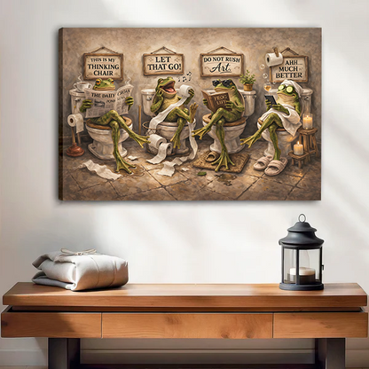 Woman holding black-framed frogs bathroom canvas wall art featuring four green frogs seated on toilets.