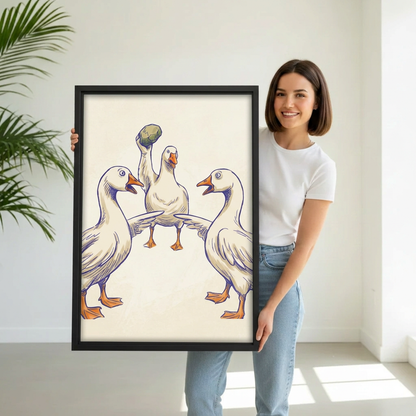 Woman holding framed funny geese canvas wall art.