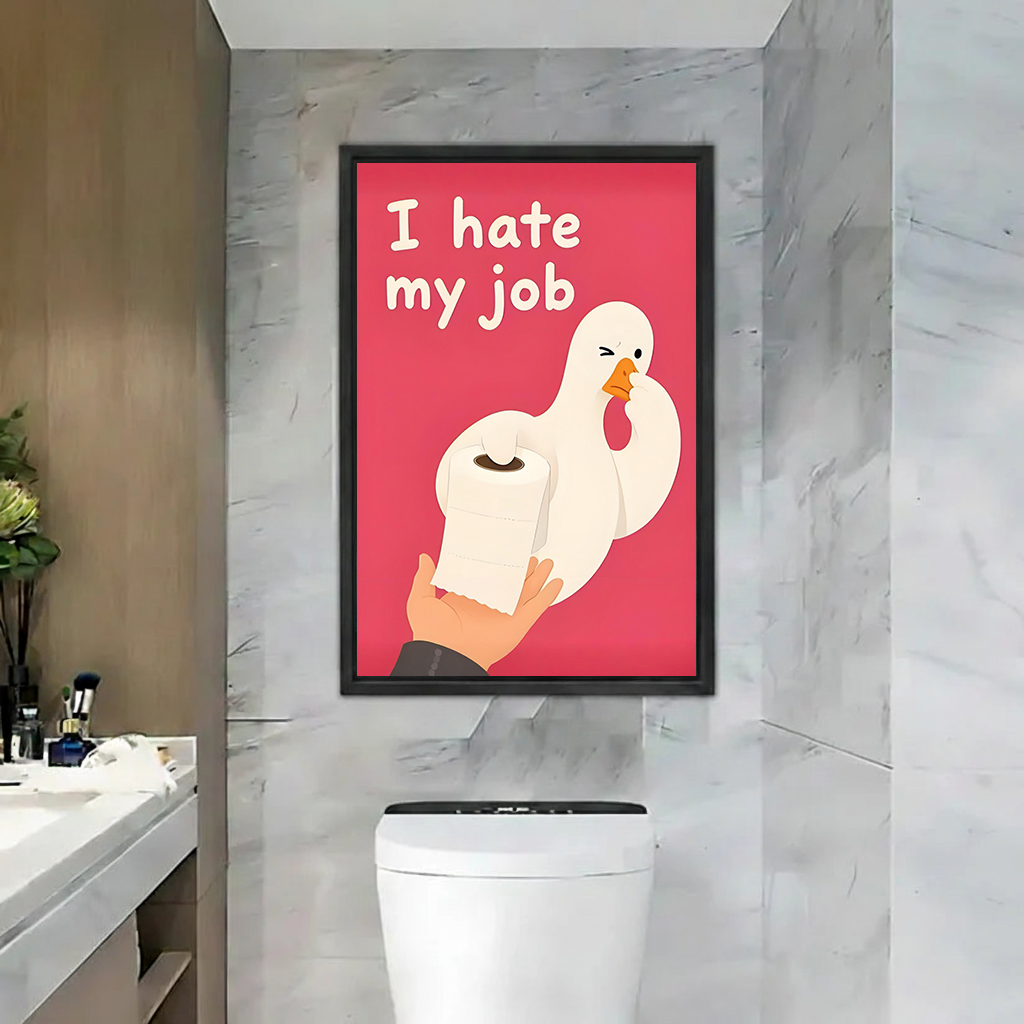 Funny goose bathroom canvas wall art in a black frame above a toilet, with white lettering on pink.