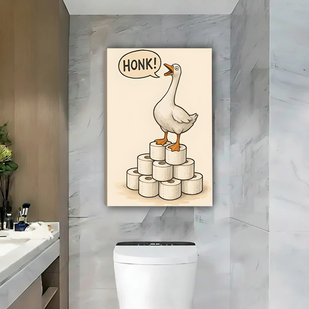 Framed funny goose canvas wall art beside a round mirror and wood vanity in a bright bathroom.