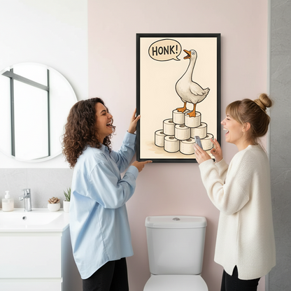 Two women admire framed funny goose canvas wall art showing a honking bird above a bathroom toilet.