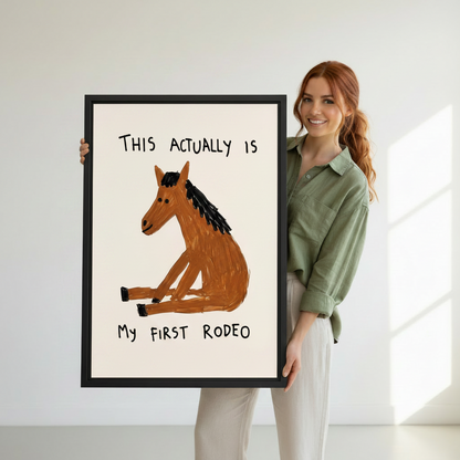 Woman holding large funny horse canvas wall art to show print size and quality of "This Actually Is My First Rodeo"