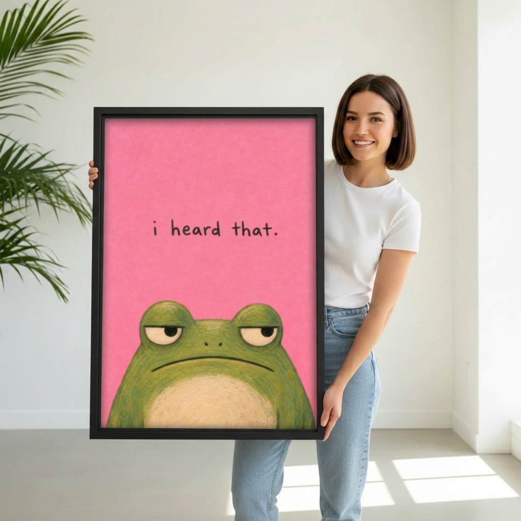 Model holding framed funny pink frog canvas wall art for size reference