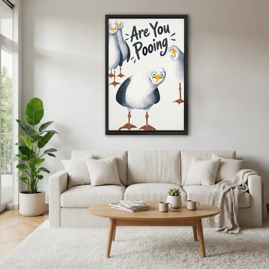 Funny seagull bathroom canvas wall art hanging above a white sofa in a light-filled room.