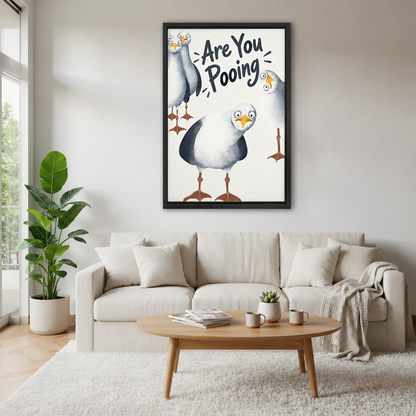 Funny seagull bathroom canvas wall art hanging above a white sofa in a light-filled room.