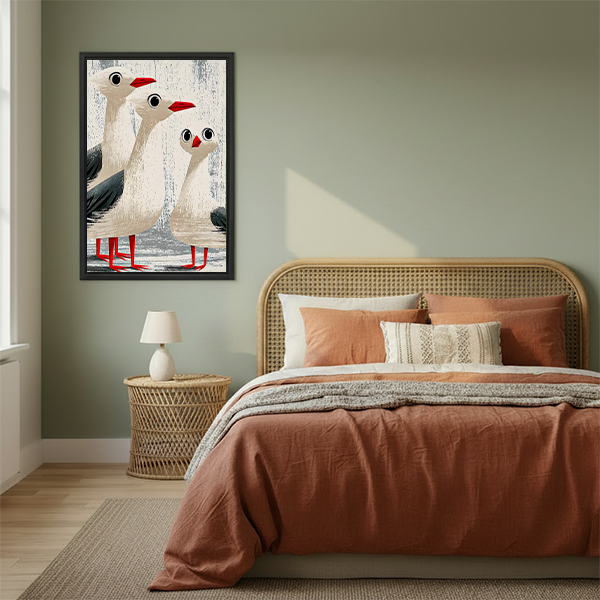 Funny seagull trio coastal framed canvas art on sage green bedroom wall above rattan headboard with terracotta bedding