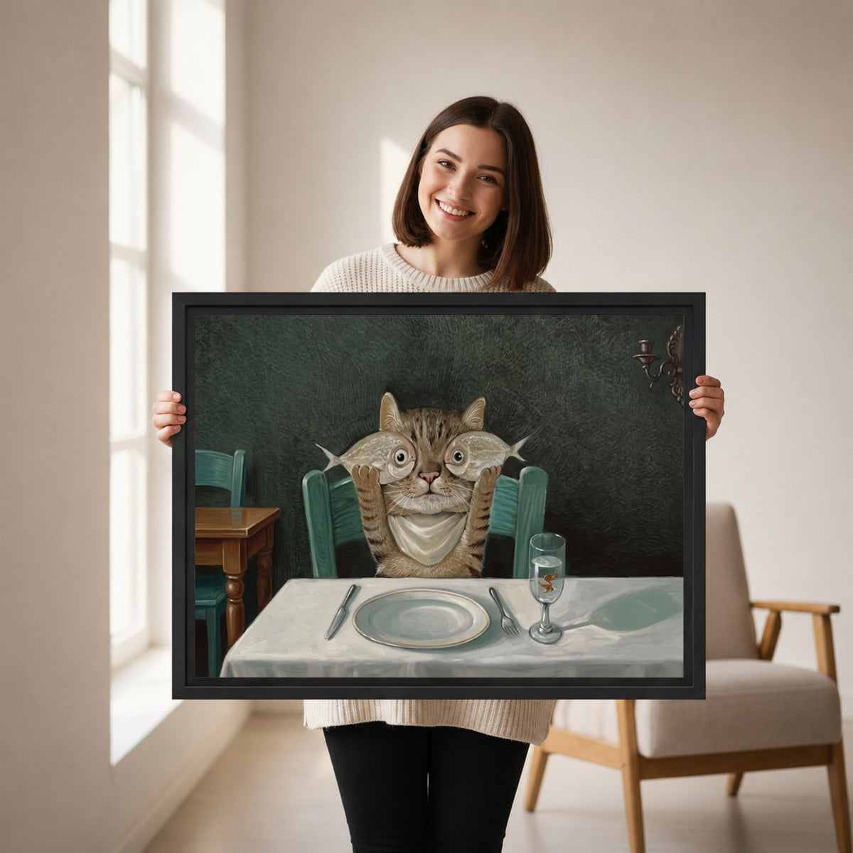 Smiling woman holding framed cat dinner canvas wall art showing tabby with fish over eyes