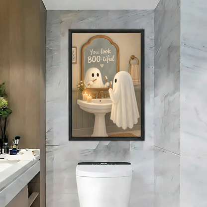 Unframed ghost bathroom canvas wall art with BOO-tiful mirror quote hanging on a marble bathroom wall