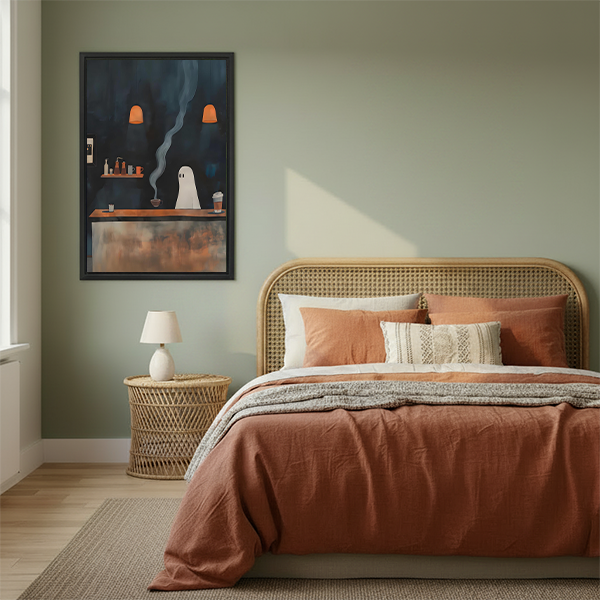 Black-framed ghost coffee shop canvas wall art hanging above a cream sofa in a living room.
