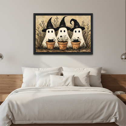 Framed vintage ghost and black cat Halloween canvas wall art above a bed with crisp white bedding