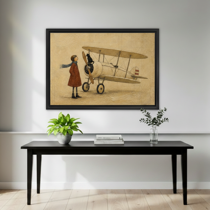 Black framed whimsical girl aviator and black cat biplane canvas hung above a sleek black console table in a minimalist entryway with a potted green plant, stacked books, and a glass vase with eucalyptus branches on a light grey wall