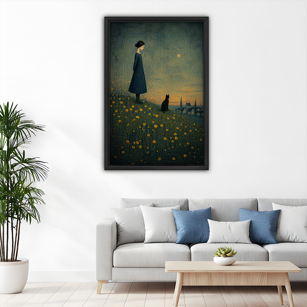 Whimsical girl and black cat canvas wall art in a black frame above a gray living room sofa.