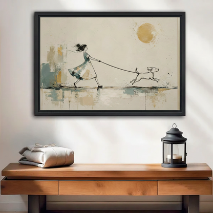 Black framed watercolor and ink canvas of a girl in a teal dress with windswept hair walking a bounding dog on a leash past abstract teal and gold brushstroke buildings under a warm golden sun, displayed above a wooden console table with a black lantern