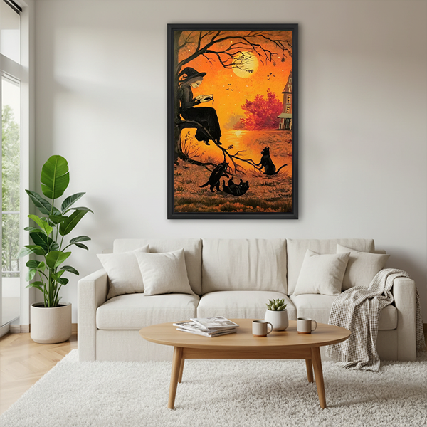 Framed gothic Halloween witch canvas wall art above a sofa, featuring a reading witch and black cats