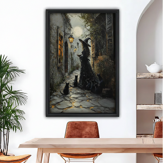 Framed gothic witch and black cats cobblestone alley canvas print in dining room setting