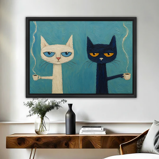 Grumpy white and black cats holding coffee cups framed canvas wall art in black float frame above wooden console