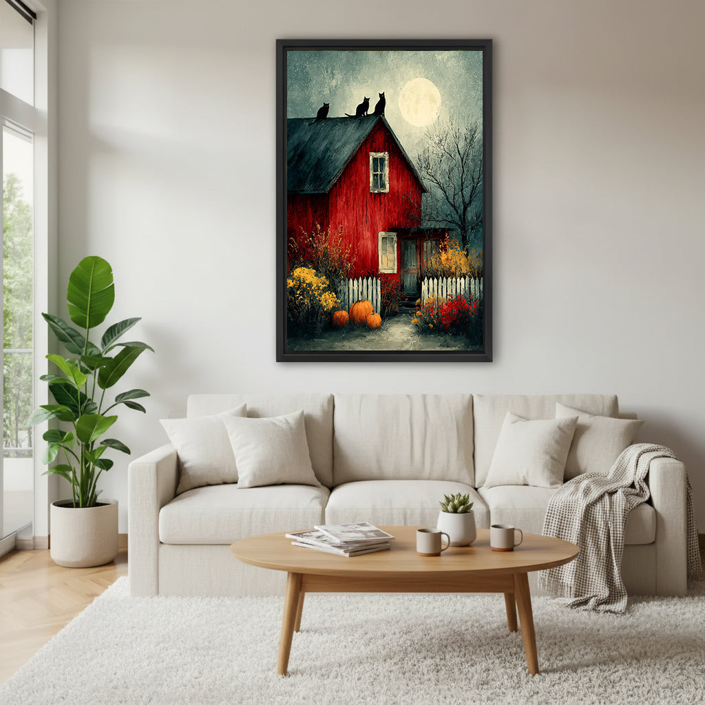 Halloween red barn three black cats full moon oil painting dark teal sky autumn wildflowers pumpkins white picket fence black framed canvas wall art above wide cream linen sofa with round wood coffee table succulent and gray houndstooth throw