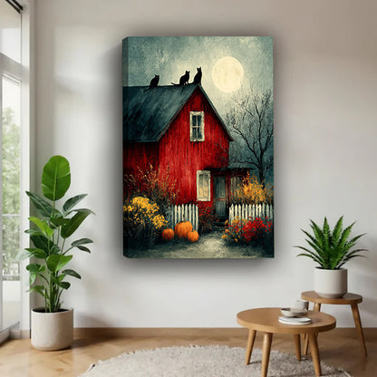 Halloween red barn three black cats full moon oil painting moody dark blue sky pumpkins red yellow autumn wildflowers white picket fence gallery wrap canvas wall art on white wall beside monstera plant and tiered round wood side table