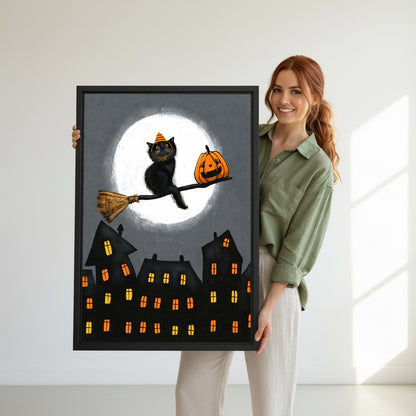 Smiling redhead woman holding large Halloween black cat witch hat broomstick jack-o-lantern full moon haunted town black framed canvas wall art size reference in bright white room