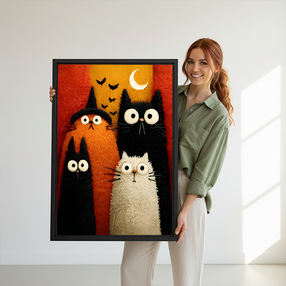 Gallery-wrap Halloween cats canvas wall art showing four playful cats against red and orange blocks between potted plants.
