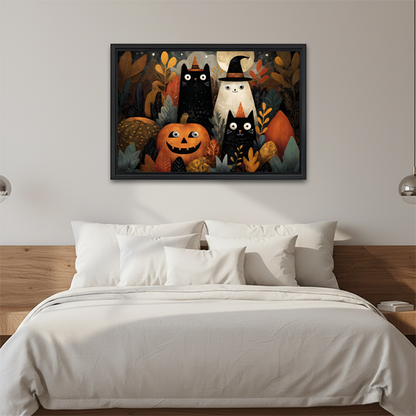 Close view of Halloween cats and ghost canvas wall art above a console with folded linens and lantern.