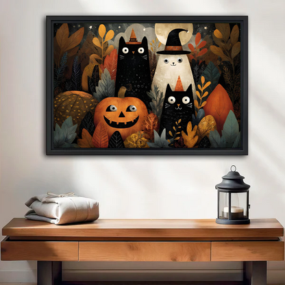 Whimsical Halloween cats and ghost canvas wall art displayed above a wooden console with a lantern.