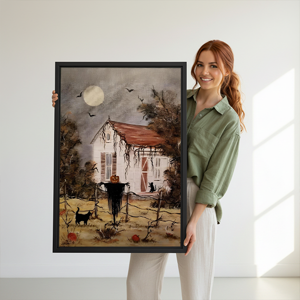 Gallery-wrap Halloween cottage canvas wall art with a white house and red roof displayed between green houseplants.