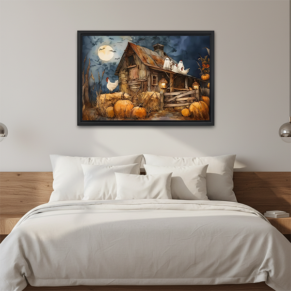 Framed Halloween farmhouse canvas wall art with glowing lanterns and pumpkins hangs above a console and lantern.