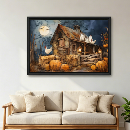 Woman holds framed Halloween farmhouse canvas wall art featuring a rustic barn, white ghosts, and pumpkins.