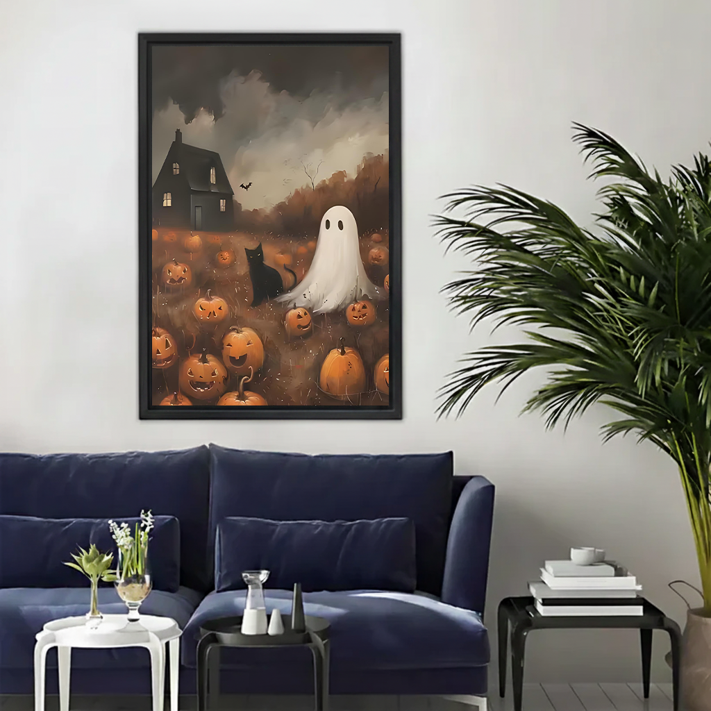 Framed Halloween ghost canvas wall art with black cat and pumpkins held in a bright living room