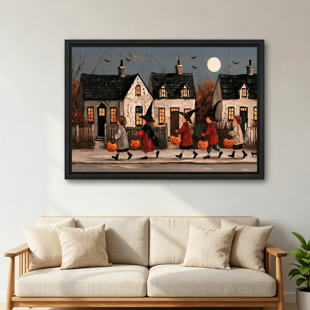 Large framed vintage Halloween parade canvas wall art above a cream sofa with matching cushions