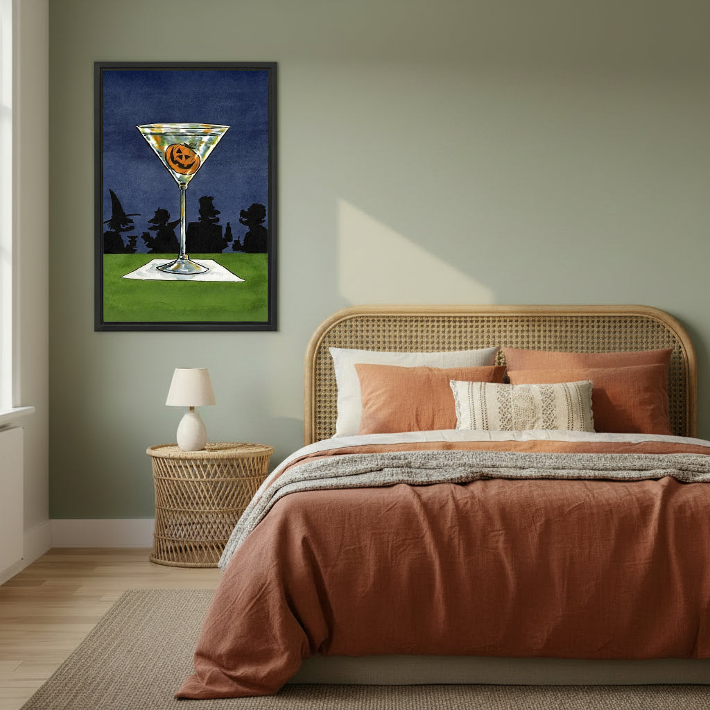 Halloween pumpkin jack-o-lantern martini cocktail retro art witch silhouette blue night sky black framed canvas wall art on sage green wall beside wide rattan arched headboard bed with terracotta linen