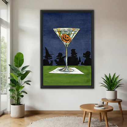 Halloween pumpkin jack-o-lantern martini cocktail retro art witch silhouette night sky black framed canvas wall art on white wall beside round wood side table with monstera and snake plant