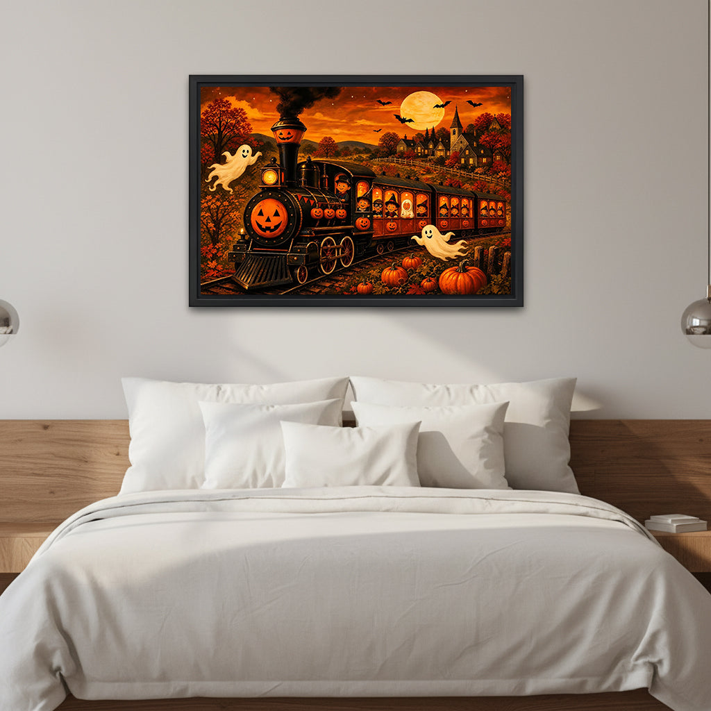 Halloween pumpkin train canvas wall art in a black frame above a white bed with a wooden headboard