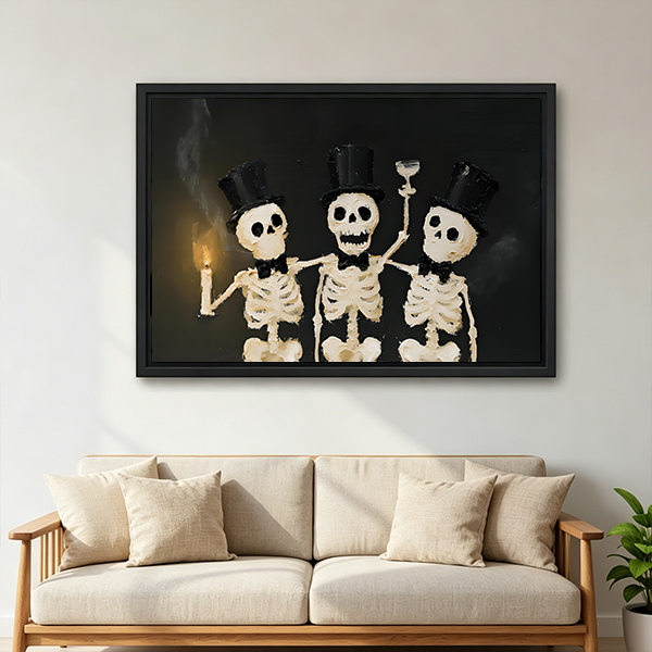 Smiling woman holding black-framed Halloween skeleton trio canvas wall art featuring three skeletons in top hats.