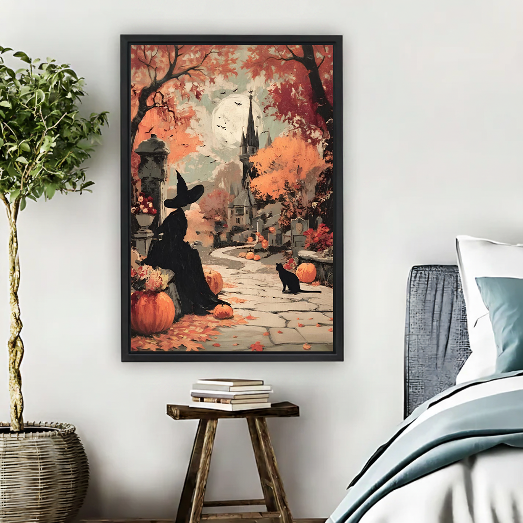 Black-framed Halloween witch and black cat canvas wall art with pumpkins and autumn trees displayed beside a bed.