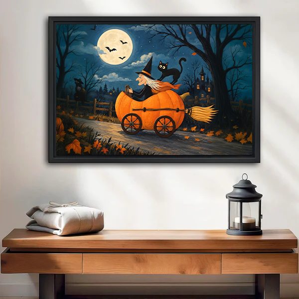 Halloween witch canvas wall art above a cream sofa, showing a pumpkin carriage under a moonlit sky